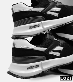 کفش کتانی مشکی سفید REEBOK Unphased Pro