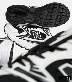 کفش کتانی مردانه و زنانه سفید مشکی NEW BALANCE 530