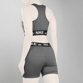 ست نیم‌تنه و کشاله بند ورزشی زنانه نایک مدل VHD-3E792 طوسی