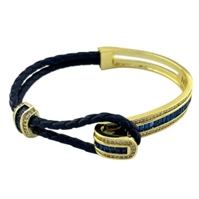 دستبند زنانه مدل آدلیا سرمه ای با بافت چرمی و جزئیات طلایی