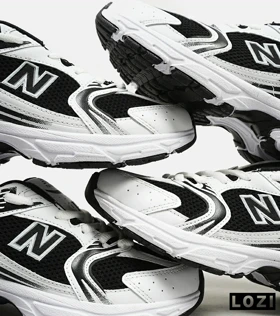 کفش کتانی مردانه و زنانه سفید مشکی NEW BALANCE 530 مدل 3144