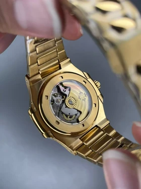 ساعت مچی پتک فیلیپ اتوماتیک بند طلایی صفحه مشکی Patek Philippe Nautilus