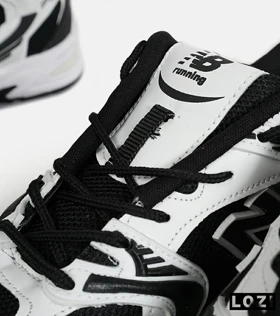 کفش کتانی مردانه و زنانه سفید مشکی NEW BALANCE 530