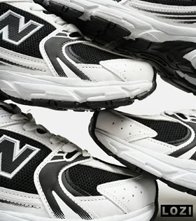 کفش کتانی مردانه و زنانه سفید مشکی NEW BALANCE 530