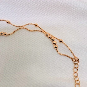 دستبند ژوپینگ مدل «البرنادو» (دوریکا) | رقص گوی‌های طلایی دور مچ