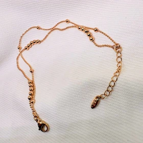 دستبند ژوپینگ مدل «البرنادو» (دوریکا) | رقص گوی‌های طلایی دور مچ