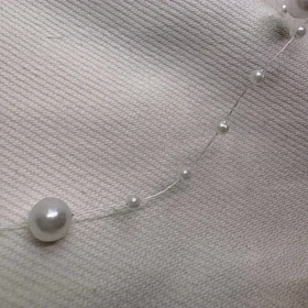 گردنبند نامرئی طرح «مروارید معلق» (Illusion Necklace) | مینیمال و اقتصادی