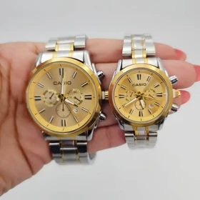 ساعت مچی ست مردانه و زنانه کاسیو Casio سبک 3موتوره و تمام استیل 5594 (بند طلایی نقره ای قاب و صفحه طلایی)