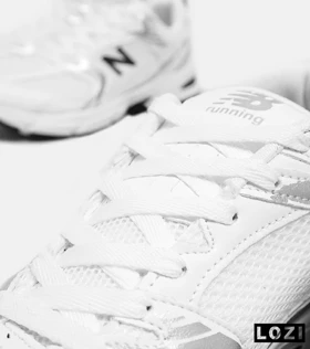 کفش کتانی مردانه و زنانه سفید نقره ای NEW BALANCE 530