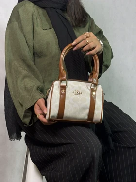 کیف صندوقی دخترانه کرم روشن با نوشته سفید کوچ coach