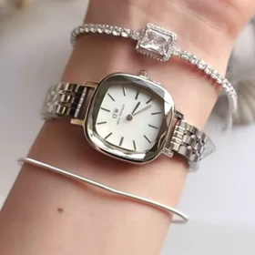 ساعت مچی زنانه DW آینه ای صفحه سفید بند سیلور