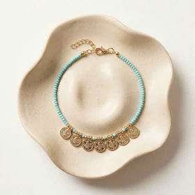 پابند مهره‌ای فیروزه‌ای با آویز سکه