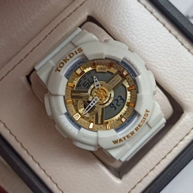 ساعت مچی اسپرت طرح جیشاک 110 رنگ سفید صفحه طلایی