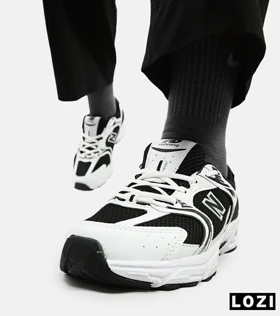 کفش کتانی بزرگ پا سفید مشکی NEW BALANCE 530 مدل 5139