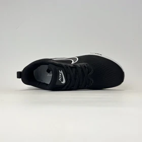 کتانی ورزشی نایک زوم ری اکت مشکی زیر سفید