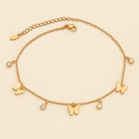 پابند زنانه استیل طلایی با آویز پروانه و نگین – Xuping