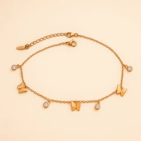 پابند زنانه استیل طلایی با آویز پروانه و نگین – Xuping