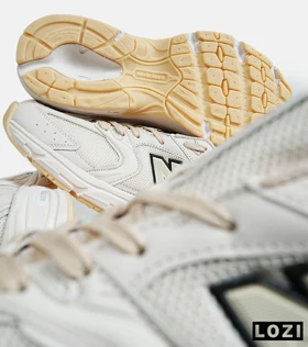 کفش کتانی مردانه و زنانه کرم NEW BALANCE 530