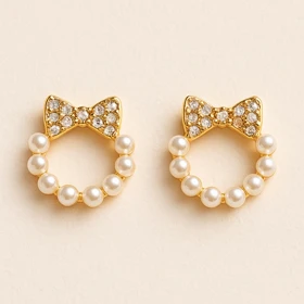 گوشواره طلایی پاپیونی با مروارید | مدل فانتزی و ظریف دخترانه