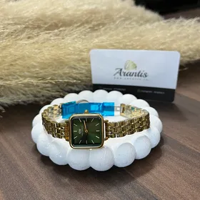 ساعت DW زنانه مربعی بند فلزی طلایی صفحه سبز w-4184
