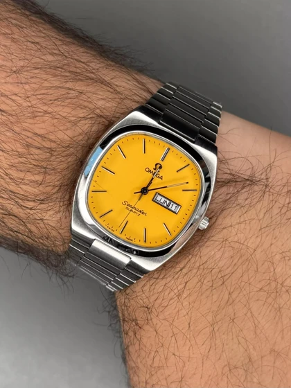 ساعت مچی امگا سیمستر نوستالژی بند سیلور صفحه زرد Omega Seamaster