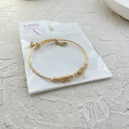 دستبند زنانه طرح طلا با گوی‌های برجسته برند ژوپینگ