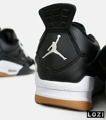 کتانی ساق‌دار بزرگ پا مشکی سفید Nike air jordan 4