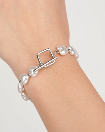 دستبند مروارید قلبی رنگ سفید با قفل T برند ژوپینگ