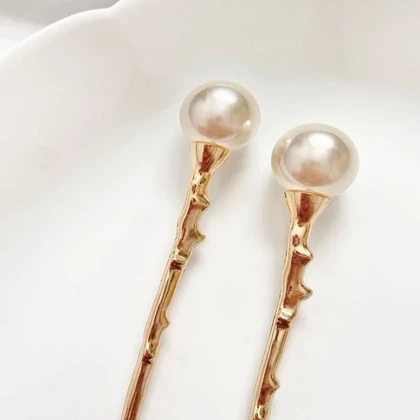 گیره مو زنانه مدل کانزاشی تک مروارید کد np255