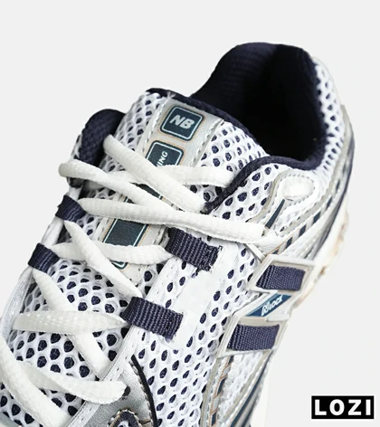 کفش کتانی مردانه و زنانه سفید سرمه ای NEW BALANCE 1064 مدل 8150