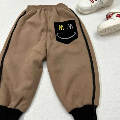 شلوار جاگر دورس لاینردار طرح MM لبخند