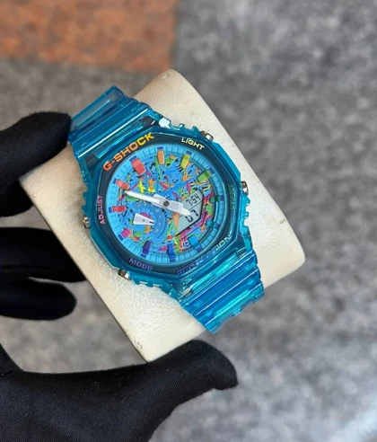 ساعت جی شاک 2100 آبی شفاف صفحه رنگی