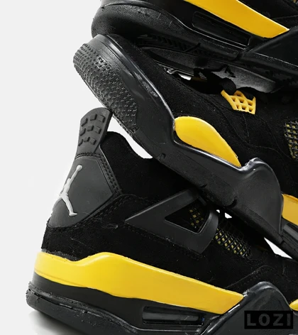 کفش کتانی ساق‌دار مردانه مشکی زرد Nike air jordan 4