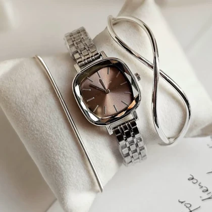 ساعت مچی زنانه DW آینه ای صفحه قهوه ای بند سیلور