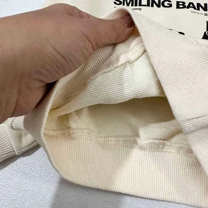 بلوز دورس کرم SMILING BAND طرح هیولا