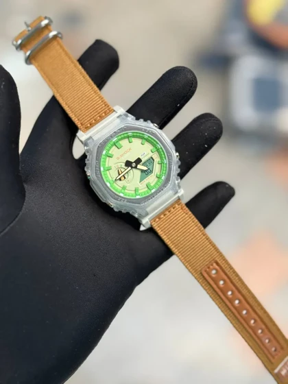 ساعت جی شاک2100بند برزنتی عسلی صفحه سبز