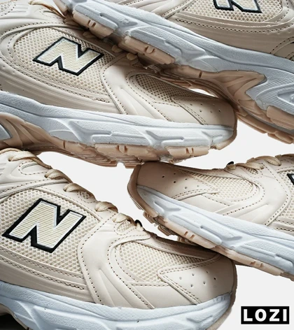 کفش کتانی مردانه و زنانه کرم NEW BALANCE 530
