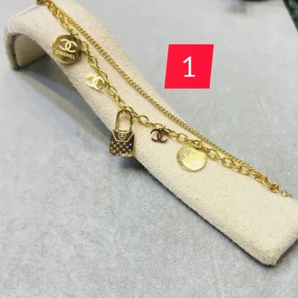 دستبند دو لاین آویزدار شل زنانه طلایی در 6طرح