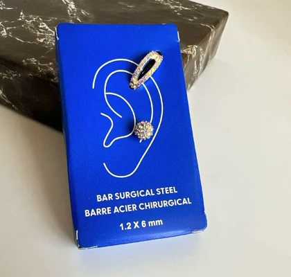 پک 2 عددی پیرسینگ گوش استیل مدل گوی و حلقه بیضی هفت‌رنگ