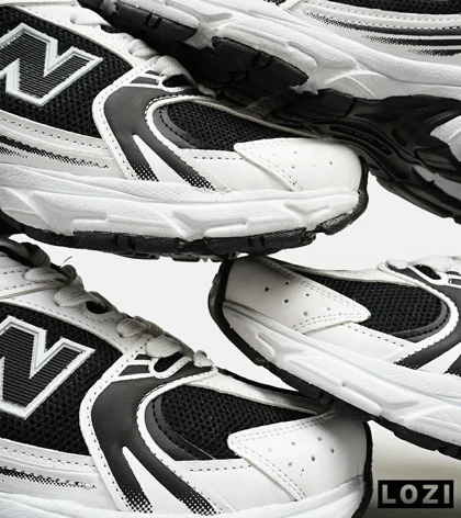 کفش کتانی مردانه و زنانه سفید مشکی NEW BALANCE 530 مدل 4697