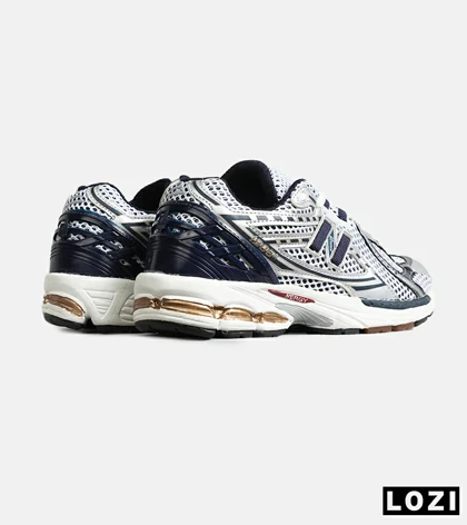 کفش کتانی مردانه و زنانه سفید سرمه ای NEW BALANCE 1064 مدل 8150