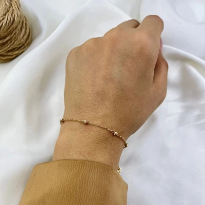 دستبند زنانه زنجیری مدل البرنادو توپی ژوپینگ طلایی رنگ ثابت