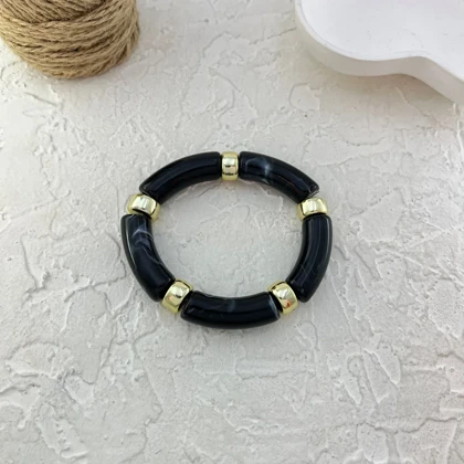 دستبند زنانه بنگل رزینی چندتکه مدل نوآرا مشکی‑طلایی