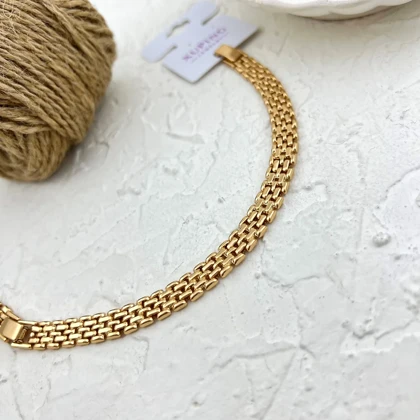 دستبند زنانه طرح حصیری با جلوه طلایی برند ژوپینگ