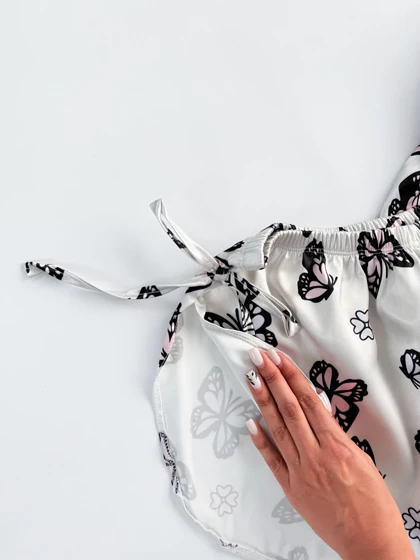 ست لباس خواب تاپ و شورتک ساتن بند دار