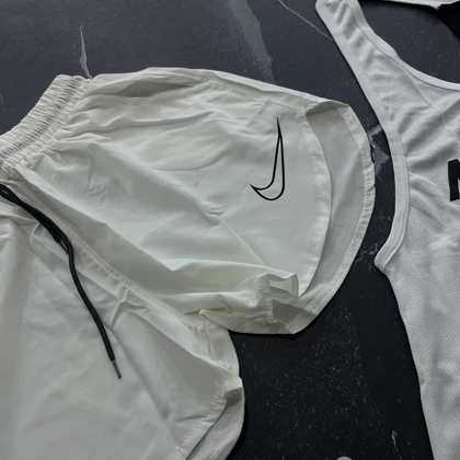 ست رکابی پشت کش نایکی + شلوارک آیرو نایکی + جوراب ساق‌دار کد E207