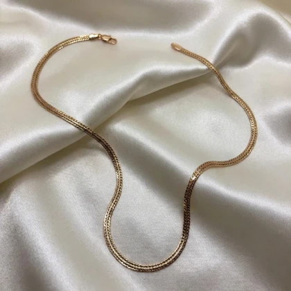 گردنبند ژوپینگ مدل «هرینگبون» (استخوان ماهی) | روبان طلایی لغزنده روی پوست