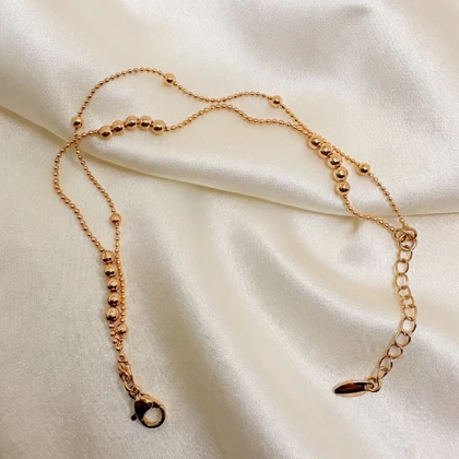 دستبند ژوپینگ مدل «البرنادو» (دوریکا) | رقص گوی‌های طلایی دور مچ