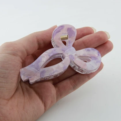 کلیپس زنانه مدل پاپیونی خال‌خالی