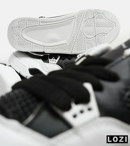 کتانی ساق‌دار بزرگ پا سفید مشکی Nike air jordan 4